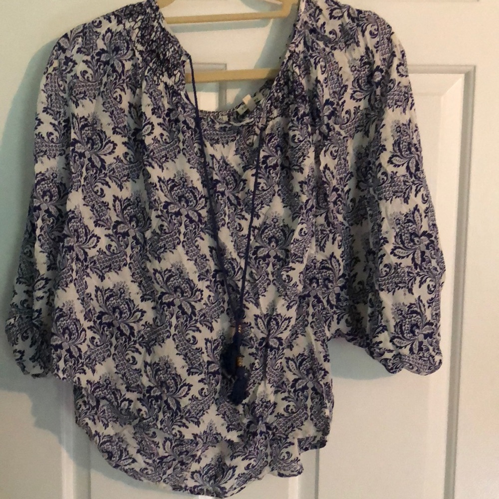 Blue floral patterned blouse with tassel